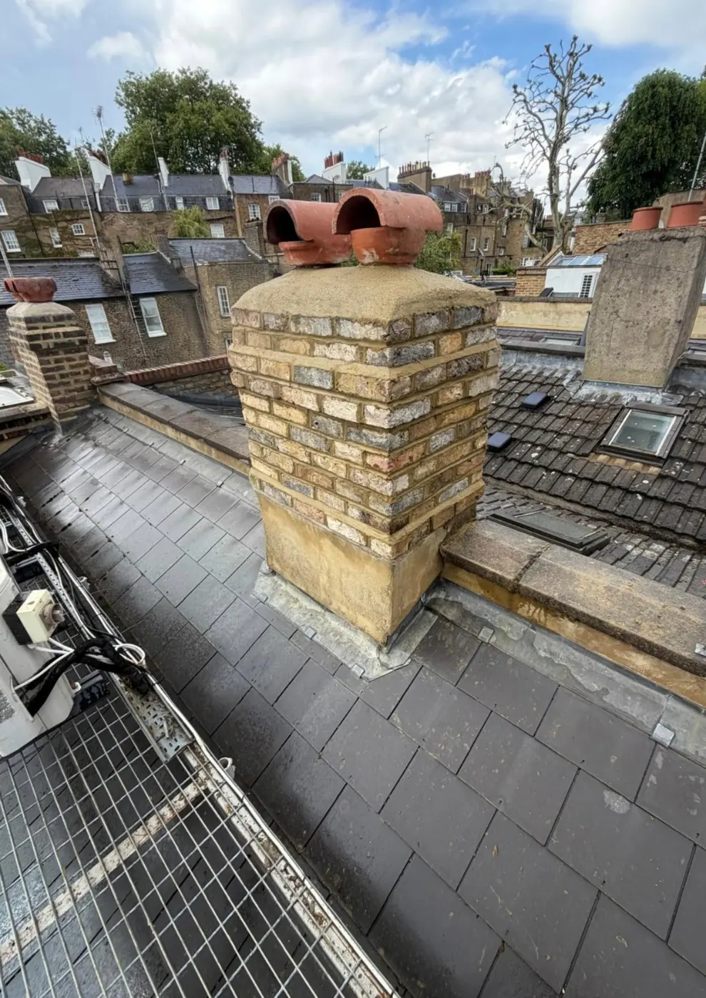After: repointed chimney with pots reinstated
