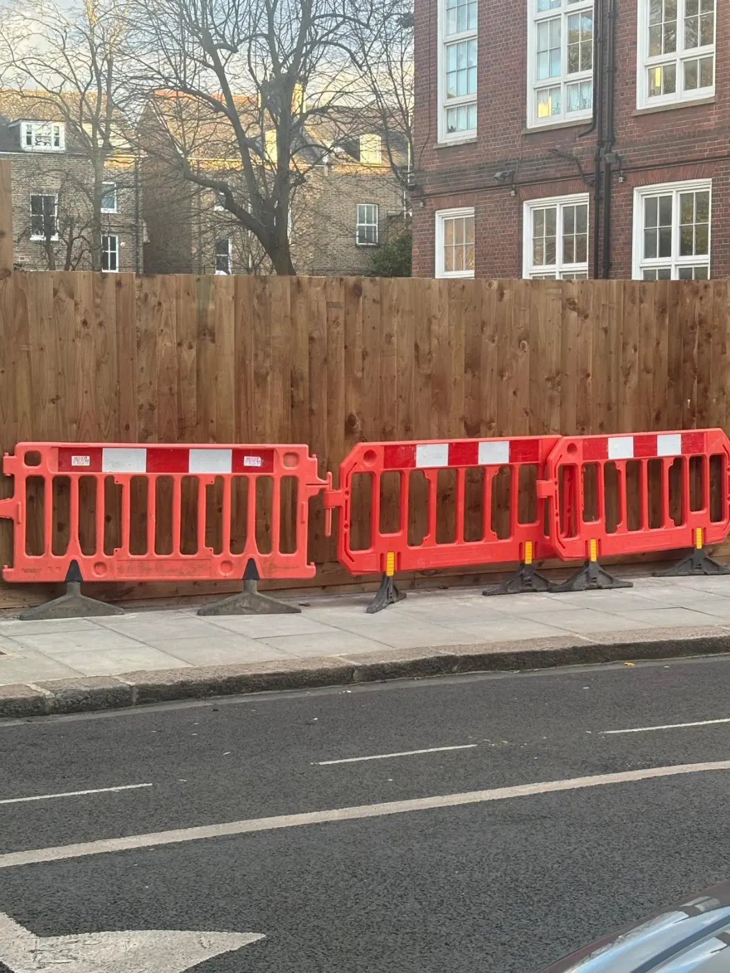 After: timber boundary at the pavement