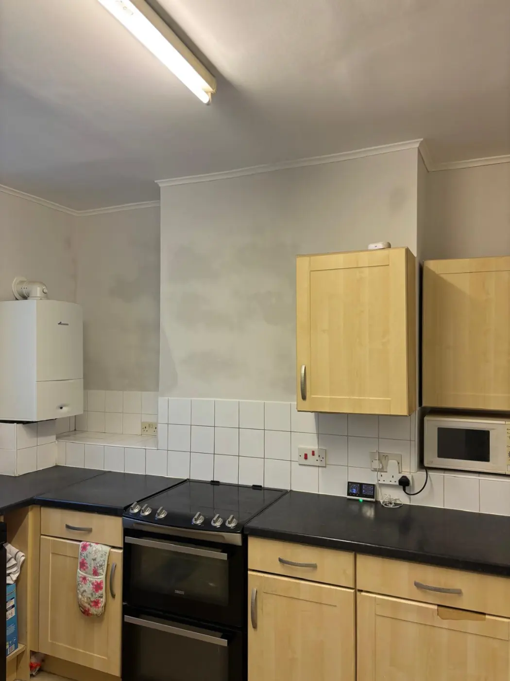 Before: the existing kitchen wall finish